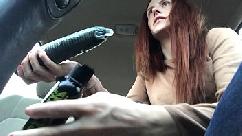 Squirting on a cucumber in a parking lot